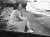 Nonie sitting on the beach, Lake Huron, 1938